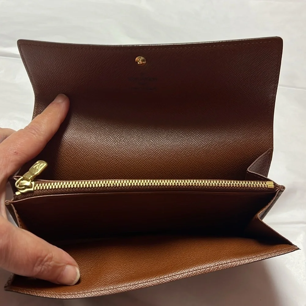 Louis Vuitton monogram sara long wallet.